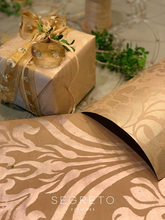 Handmade Segreto-style DIY gift wrapping paper with decorative painted patterns — holiday craft project
