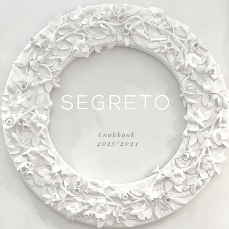 Segreto Holiday Lookbook 2023-2024 cover with festive interior featuring layered textures and seasonal decor