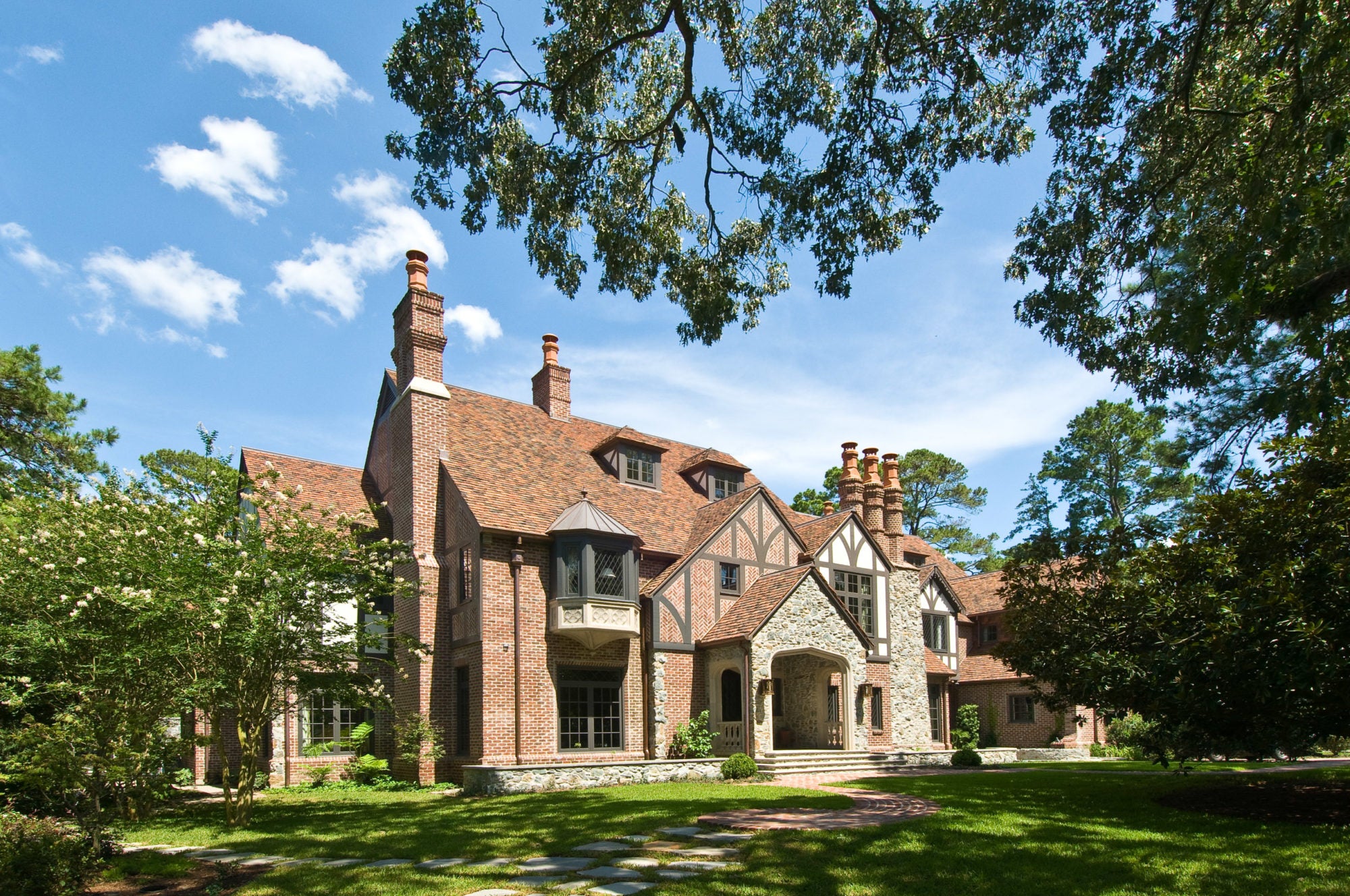 Hand-painted architectural detail designed to replicate stone in English Tudor exterior