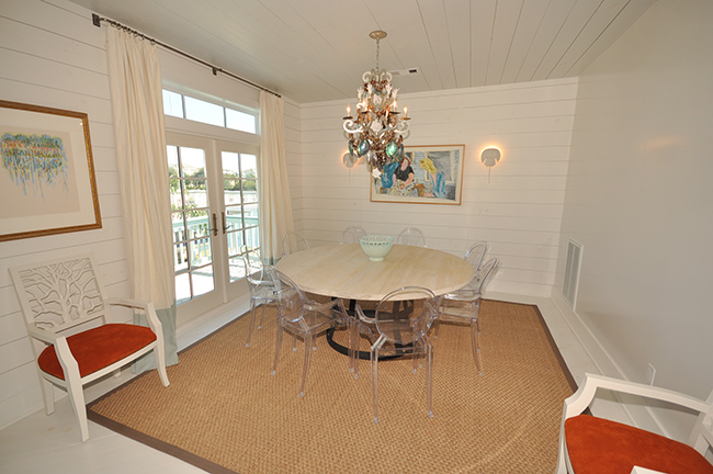 Segreto Secrets - Galveston Beach House - Dining Room with Lucite Chairs and Seagrass Rug