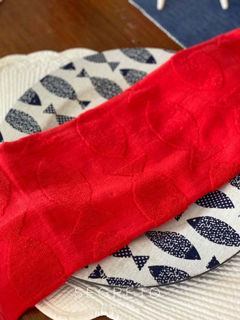 red fish dish towel as a napkin