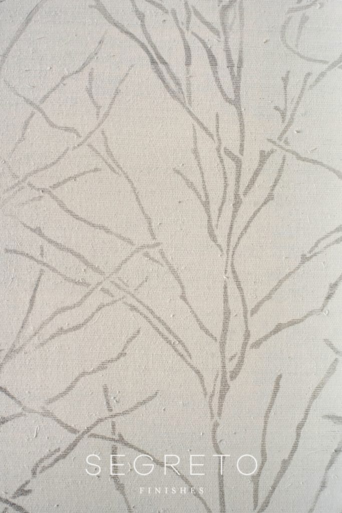 tree branch stencil design over wallcovering