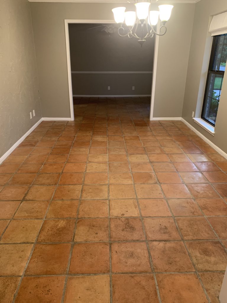 Empty room with terra cotta tile flooring